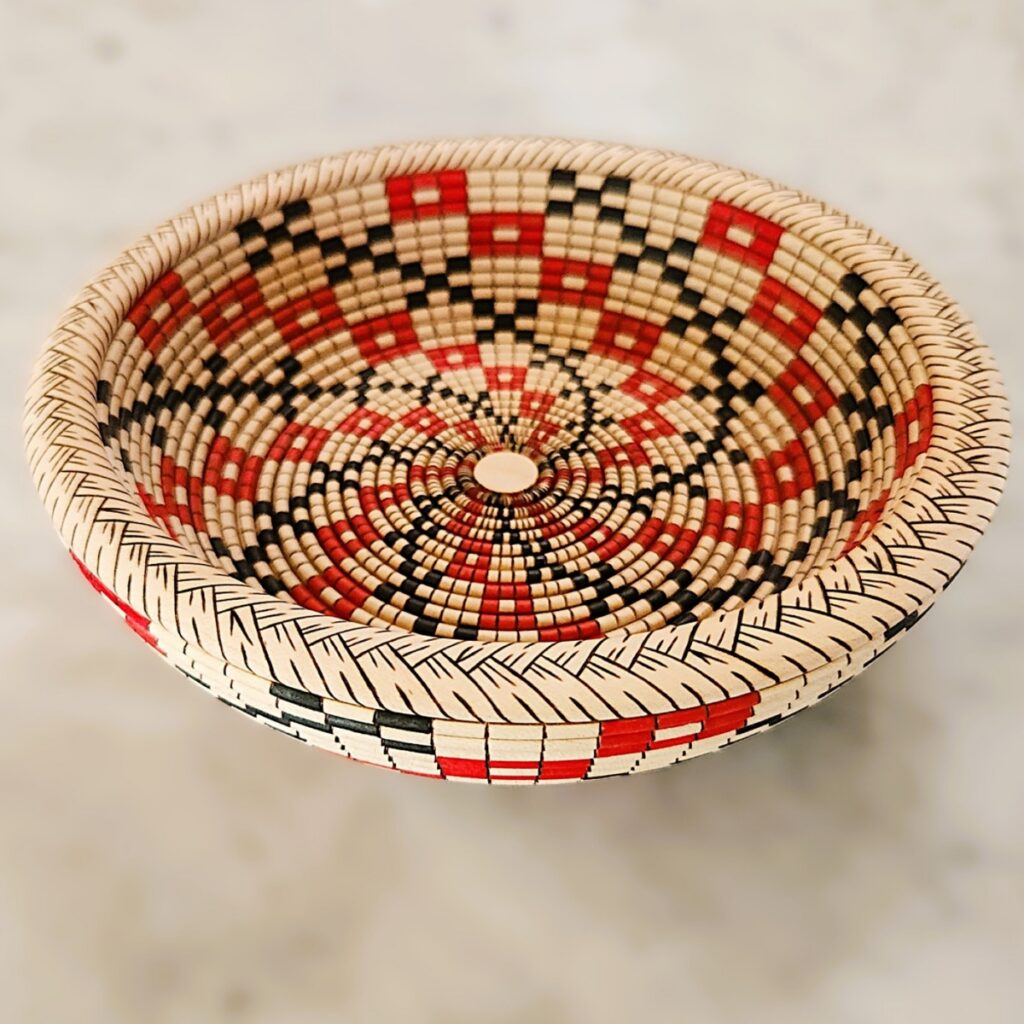 David Croxton hand-turned wood bowl featuring a red and black basketweave illusion pattern.