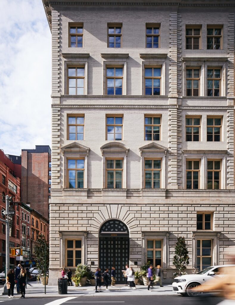 Exterior view of The Fifth Avenue Hotel in Nomad, featuring the historic Renaissance-style palazzo and the modern 24-story glass tower addition.