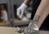 Tin Artist Justin Gallegos Mayrant on the 100th Traditional Spanish Market A tin cross with small detail embellishments.