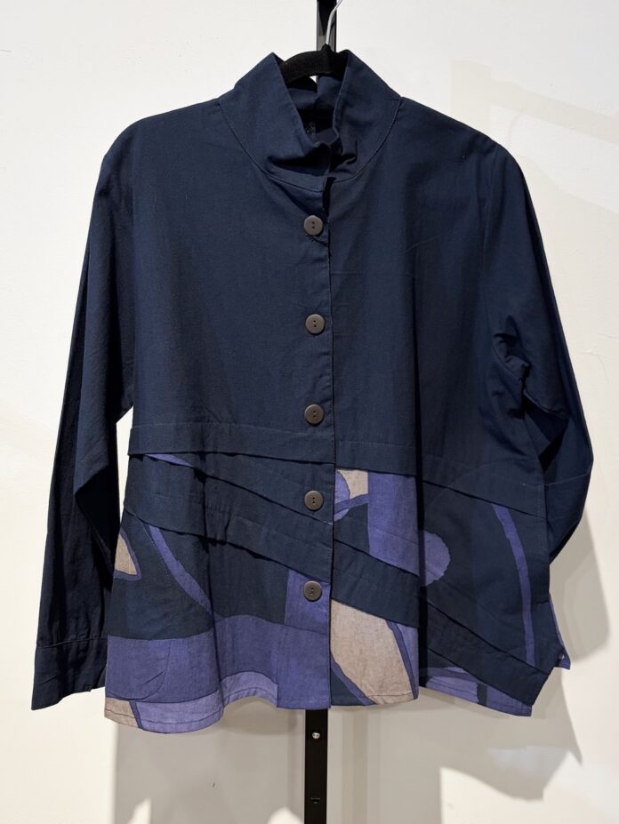 Santa Fe Summer Shopping: Five Artisan Finds from Local Boutiques and Designers A long dark blue button up with a pattern at the bottom.
