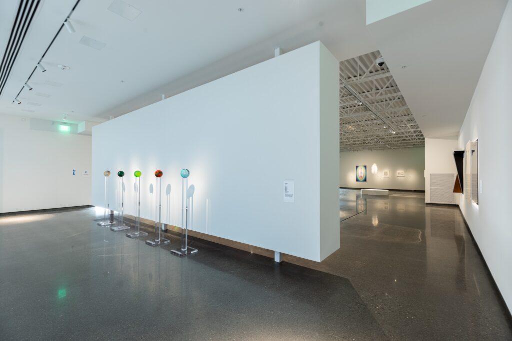 A photo of a room with a floating white wall inside the Vladem Contemporary New Mexico Museum of Art.