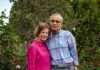 Growing a Garden With 225 Rose Plants in New Mexico Jack and Juanita Ortega standing side-by-side with arms around each other in their lush, flower-filled rose garden in Santa Fe.