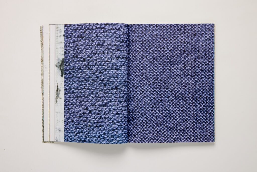 Open page spread from Laurie Lambrecht’s art book tēxēre showcasing detailed purple woven fabric textures.