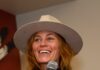 Santa Fe International Film Festival 2026 Returns with Five Days of Cinema Woman wearing a beige hat speaking into a microphone at the Santa Fe International Film Festival.