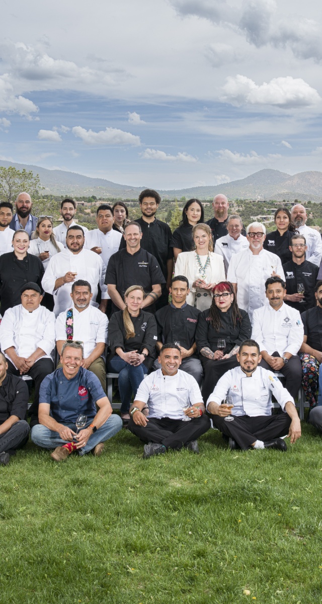 Close-up detail shot of chefs posing for a group portrait at the Santa Fe Wine & Chile Fiesta.