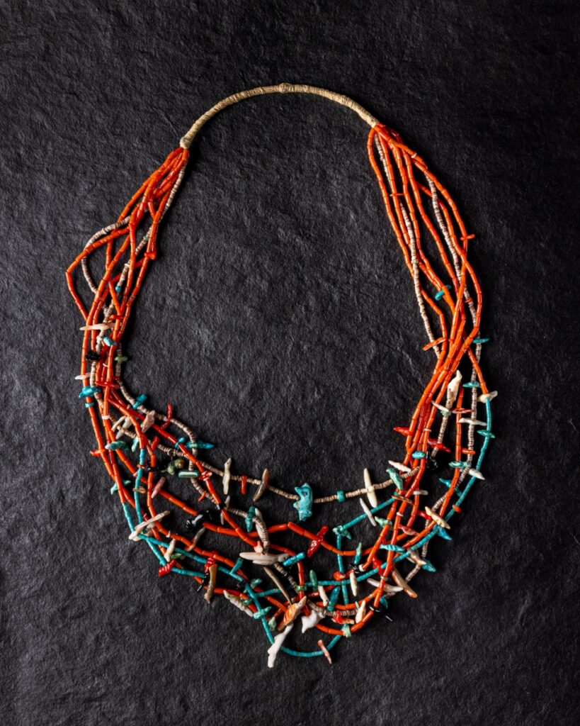 Multi-strand fetish necklace carved by Zuni artist Leekya with bird and animal figures.