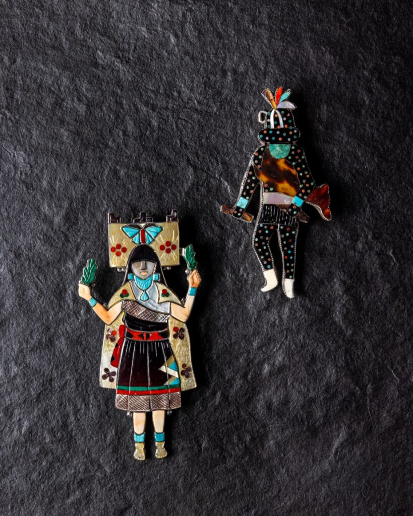 Zuni inlaid figure pendants depicting the Butterfly Maiden Polik Mana and Shulawitsi, the Little Fire God.